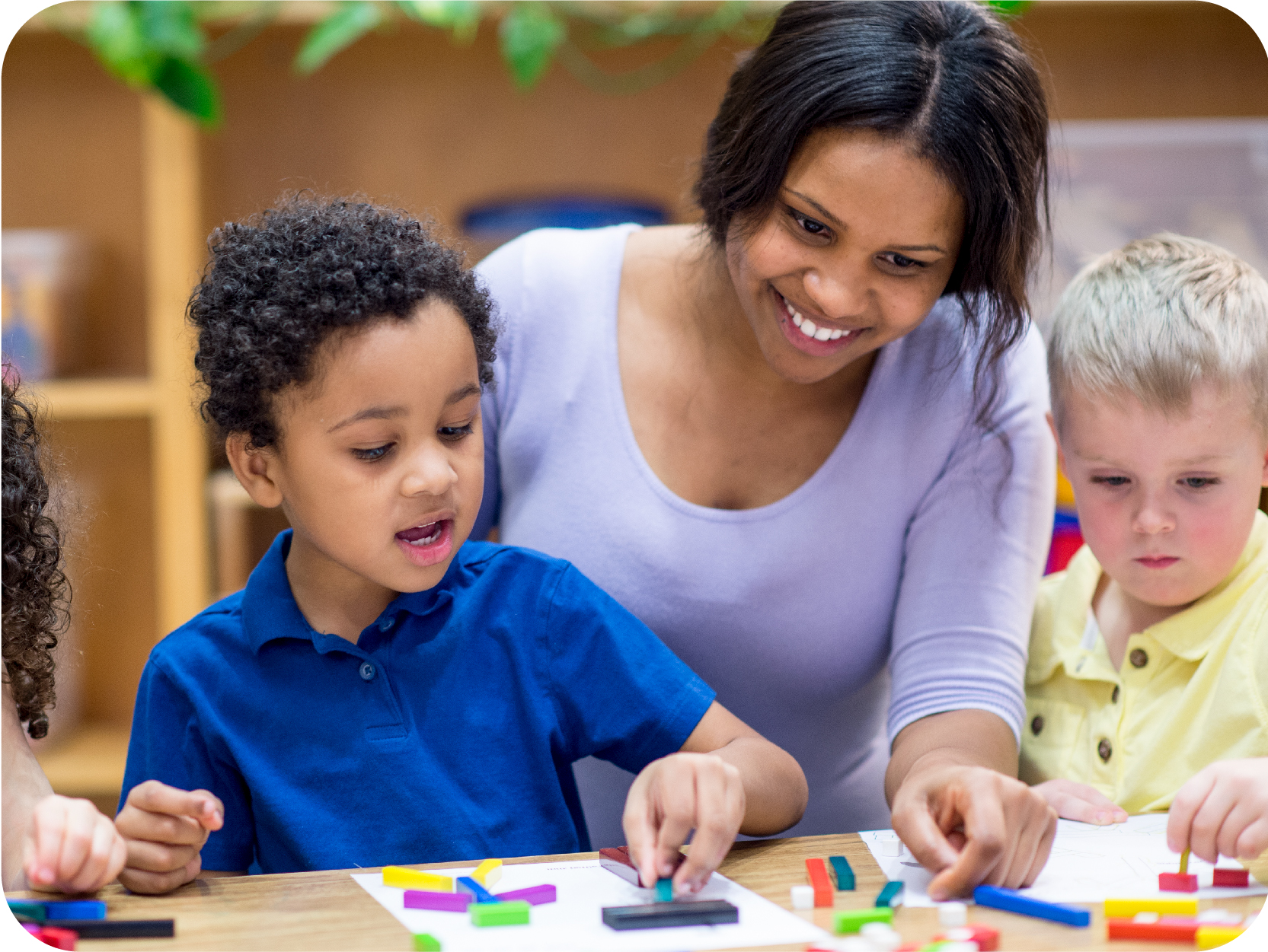 Child care provider playing with children